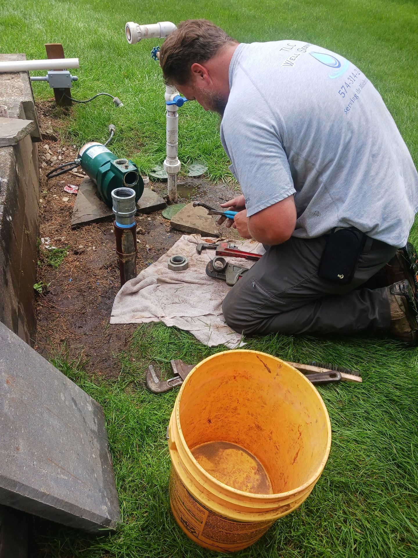 TLC Well Service technician working on residential well equipment to diagnose water quality and sediment issues